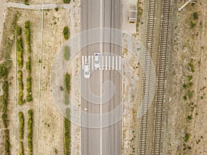 Aerial top view of crosswalk on a countryside fast speed road f