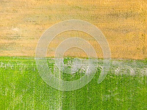 Aerial top view of a different agriculture fields in countryside on a spring day. Drone shot