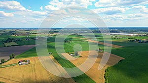 Aerial top view of a different agriculture fields in countryside on a spring day. Drone shot