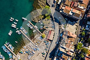 Aerial top view of a dock with boats in Aci Trezza, Sicily, Italy