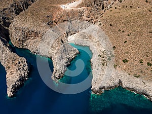 Aerial top view by drone of beach of Seitan Limania in bay with turquoise water and an unusual shape in Akrotiri, Crete