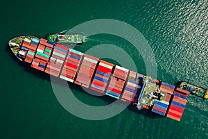 Aerial top view from drone, Container ship  sailing on the green sea