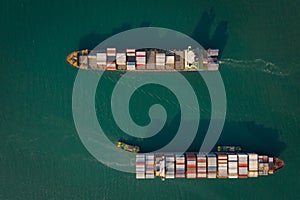 Aerial top view from drone, Container ship  sailing on the green sea