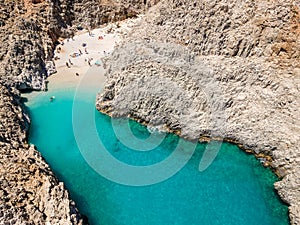 Aerial top view by drone of Seitan limania or Agiou Stefanou beach with turquoise water in Chania, Akrotiri, Crete, Greece