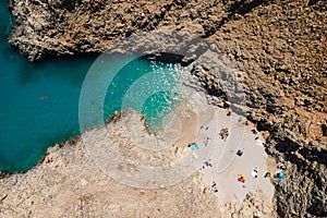 Aerial top view by drone of Seitan limania or Agiou Stefanou beach with turquoise water in Chania, Akrotiri, Crete, Greece