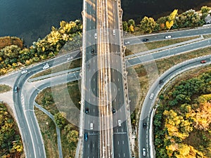 Aerial or top view from drone to road junction, freeway and bridge and car traffic in big city, urban transportation concept