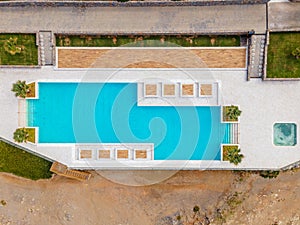 Aerial top view by drone of a tropical hotel with a pool