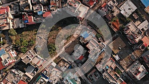 Aerial top view with drone on a typical building in Kathmandu, looks like a slum, but these are ordinary houses.