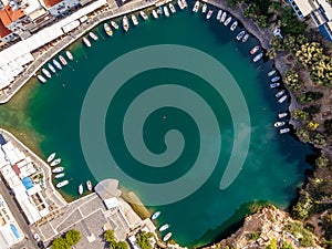 Aerial top view by drone of Voulismeni Lake in Agios Nikolaos city. Greece, Crete