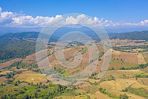 Aerial top view of dry paddy rice terraces, green agricultural fields in countryside, mountain hills valley in Asia, Pabongpieng,