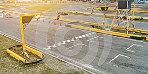 Aerial top view of the go-kart track from the drone. Kart racers drive on the open track.