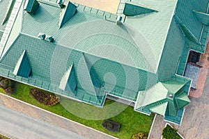 Aerial top view of green metal sloping roof