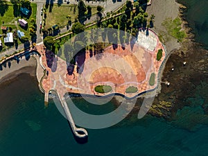 Aerial top view of a green park near lake Llanquihue in Chile