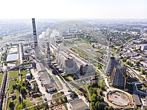 Aerial top view of heat power plant against sky background