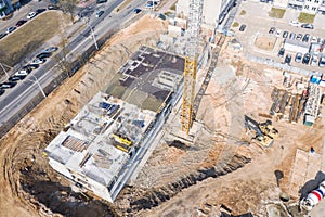 Aerial top view of heavy industrial machinery working at construction site