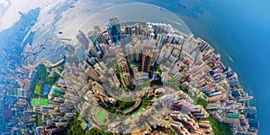 Aerial top view of Hong Kong Downtown, republic of china. Financial district and business centers in smart urban city in Asia.