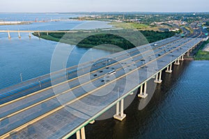 Aerial top view of huge complex road junction at cars driving on the Alfred E. Driscoll Bridge across the Raritan River