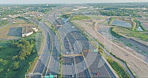 Aerial top view of huge complex road junction at cars driving on the Alfred E. Driscoll Bridge across the Raritan River