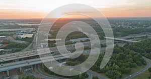 Aerial top view of huge complex road junction at cars driving on the Alfred E. Driscoll Bridge across the Raritan River