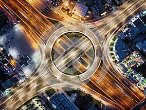 Aerial top view of a illuminated multilevel junction ring road as seen in Attiki Odos, Athens photo