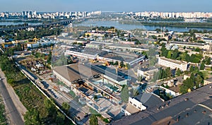 Aerial top view of industrial park zone from above, factory chimneys and warehouses, industry district