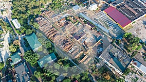 Aerial top view of industrial park zone from above, factory chimneys and warehouses, industry district