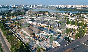 Aerial top view of industrial park zone from above, factory chimneys and warehouses, industry district photo