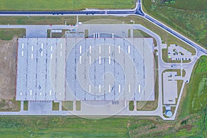 Aerial Top View of Industrial Storage Building Area Many Trucks Unloading Merchandise