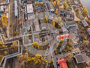 Aerial or top view of industrial zone near energy power plant or factory with warehouses, pipelines and other buildings