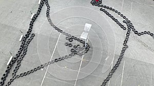 Aerial top view of the karting track made of old black car tires, motorsport concept. Media. Outdoors karting track
