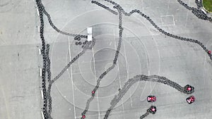 Aerial top view of the karting track made of old black car tires, motorsport concept. Media. Outdoors karting track