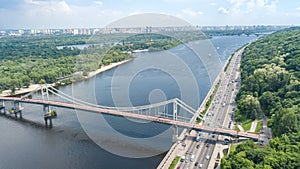 Aerial top view of Kiev city from above, Kyiv skyline, hills, pedestrian Park bridge and Dnieper river cityscape, Ukraine photo