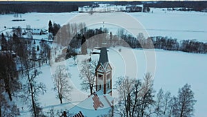 Aerial Top View of the Krimulda Evangelic Lutheran Church in Winter at Sunrise