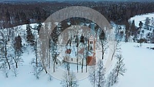 Aerial Top View of the Krimulda Evangelic Lutheran Church in Winter at Sunrise