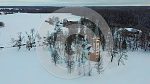 Aerial Top View of the Krimulda Evangelic Lutheran Church in Winter at Sunrise