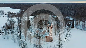 Aerial Top View of the Krimulda Evangelic Lutheran Church in Winter at Sunrise