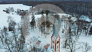 Aerial Top View of the Krimulda Evangelic Lutheran Church in Winter at Sunrise