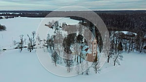 Aerial Top View of the Krimulda Evangelic Lutheran Church in Winter at Sunrise