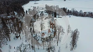 Aerial Top View of the Krimulda Evangelic Lutheran Church in Winter at Sunrise