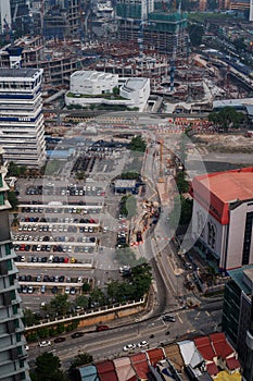 Aerial top view of Kuala Lumpur city traffic and buildings