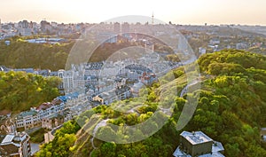 Aerial top view of Kyiv cityscape of Vozdvizhenka and Podol historical districts on sunset from above, city of Kiev photo