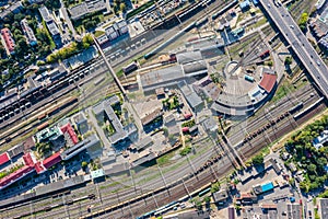 Aerial top view of locomotive train depot in industrial district