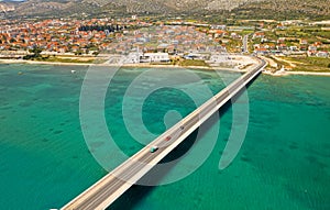 Aerial top view of a long bridge above a sea, island Ciovo in Croatia
