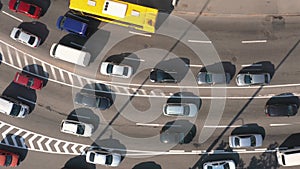 Aerial top view of many cars stucked in a traffic jam.
