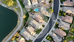 Aerial top view of Menifee Lake and neighborhood, residential subdivision vila during sunset.