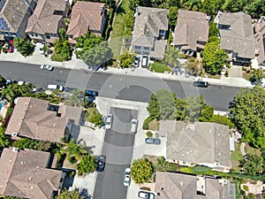 Aerial top view of middle class subdivision neighborhood with residential villas next to each other.