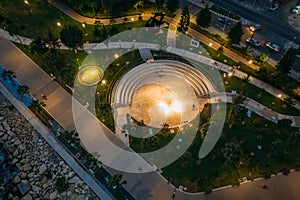 Aerial top view of Molos Park at night. Famous Limassol, Cyprus walking alley in evening, drone photo