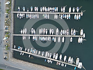 Aerial top view of moored boats on the harbor of Assens