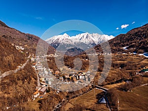 Aerial top view Mountain village with lift in Italy Alps