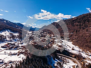 Aerial top view Mountain village with lift in Italy Alps